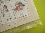 K Sakai stamps